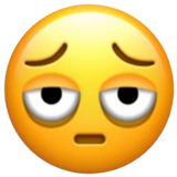 Apples version of the 'Face with Bags Under Eyes' emoji